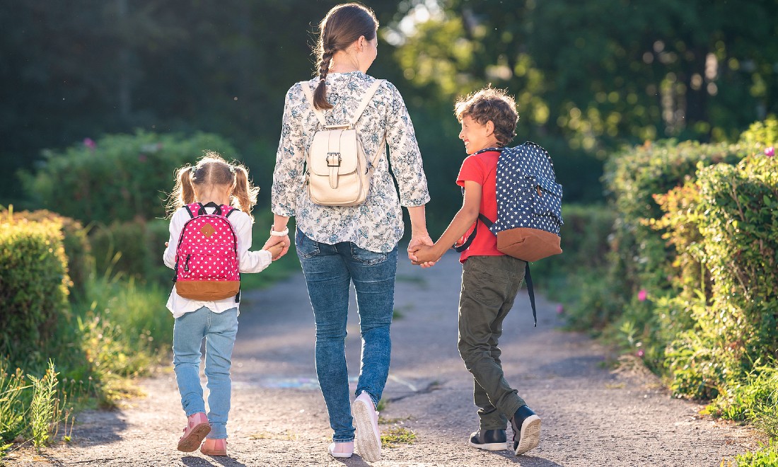 mother and kids walking home from school - Amity International School Amsterdam