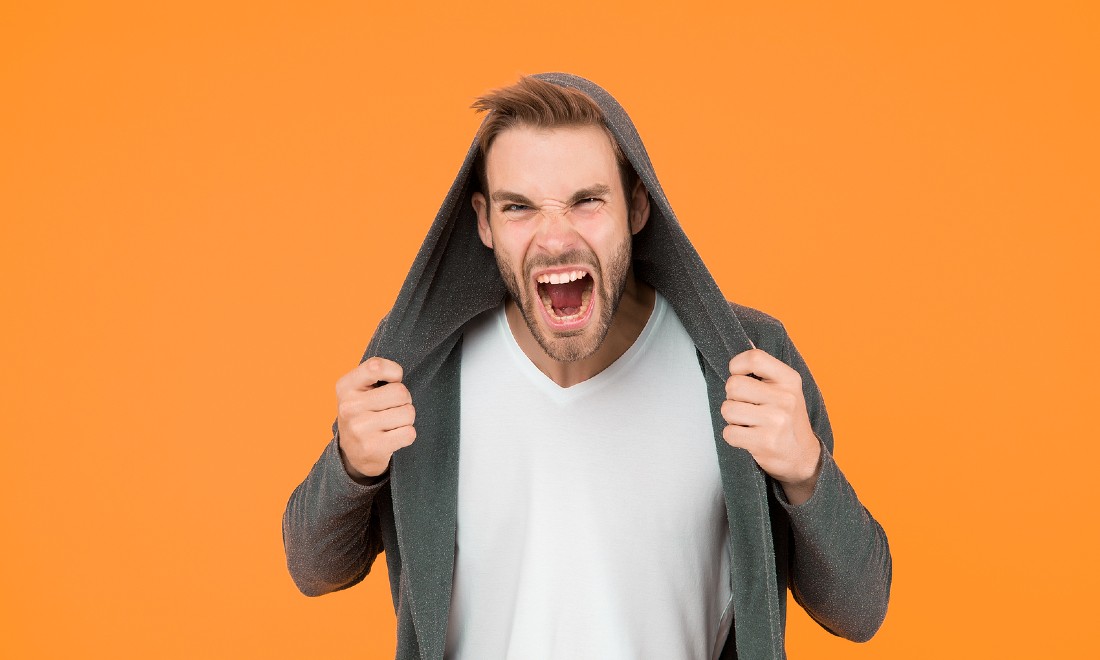 Angry man orange background