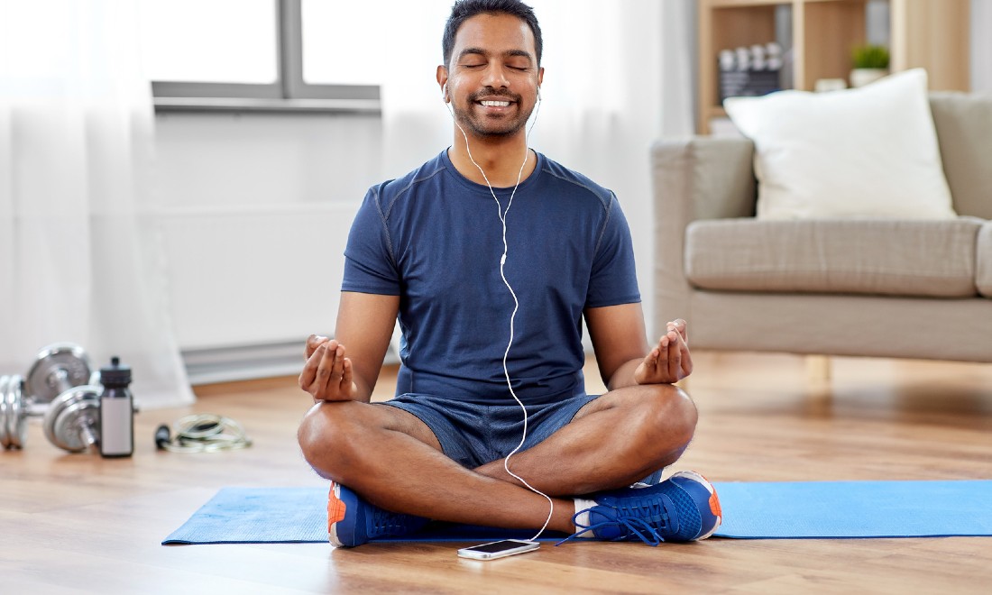 6 useful mental health apps - man meditating yoga mat