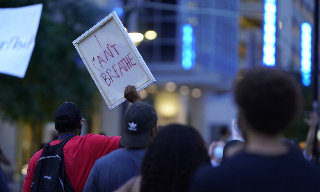 anti-racism protester with sign