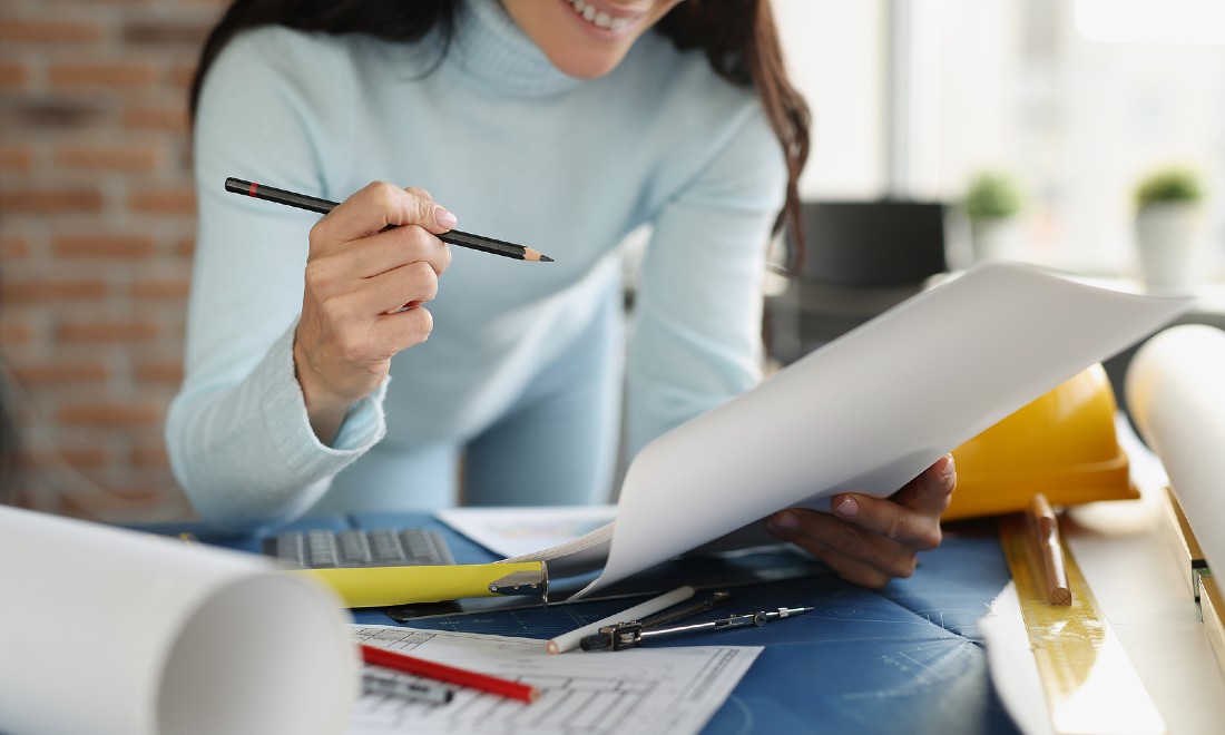 female architect looking at plans