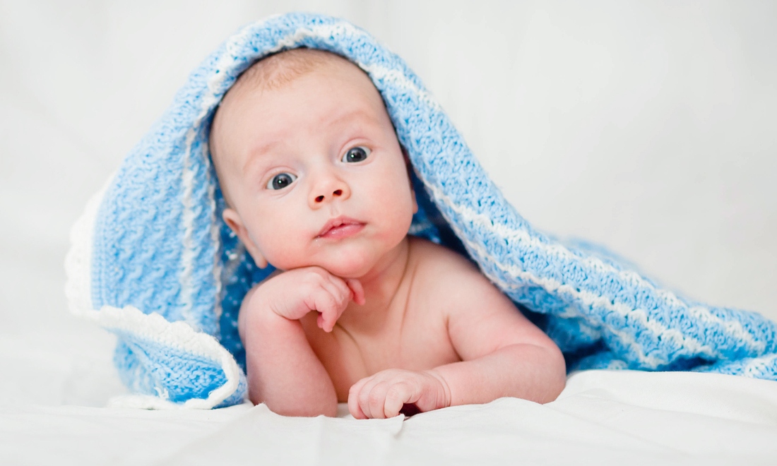 Baby under blankets