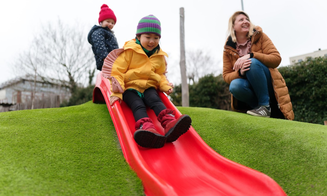 Big Ben Kids playing on slide