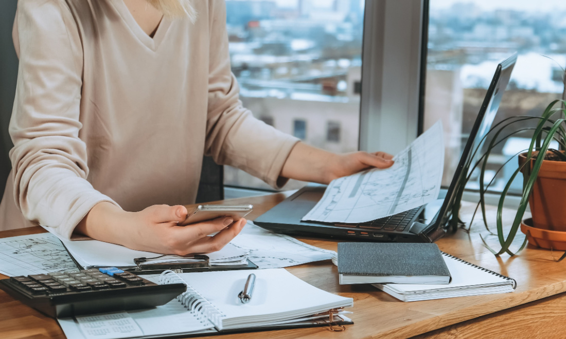 Blue Umbrella woman doing taxes