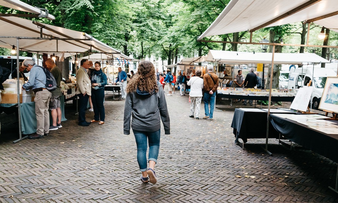 Woman walking through Dutch book market