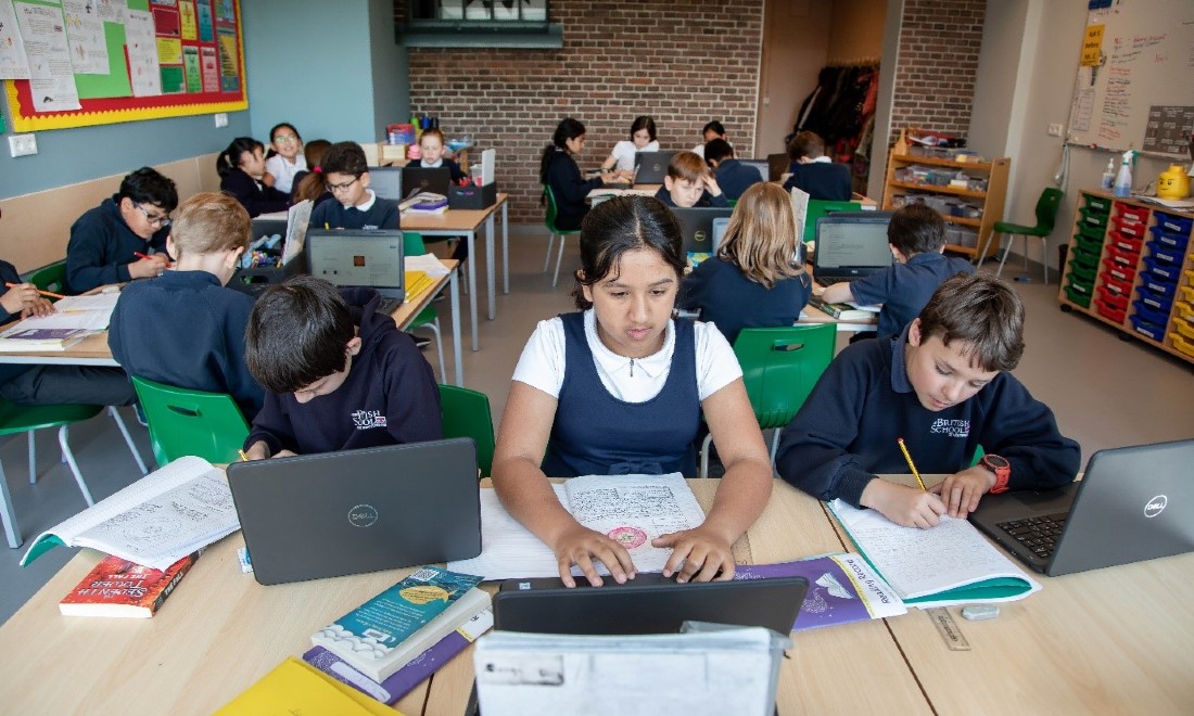 british school students learning classroom