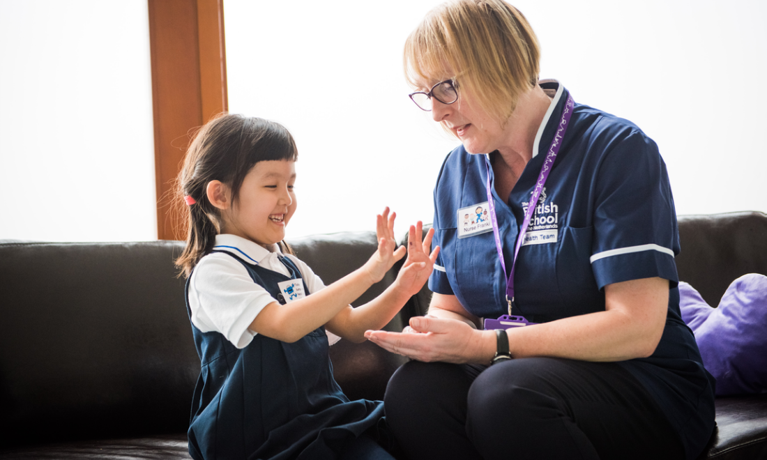 Nurse with young girl