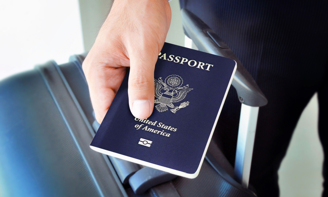 businessman holding us passport