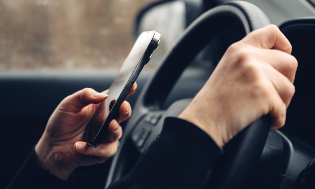 Person driving while texting