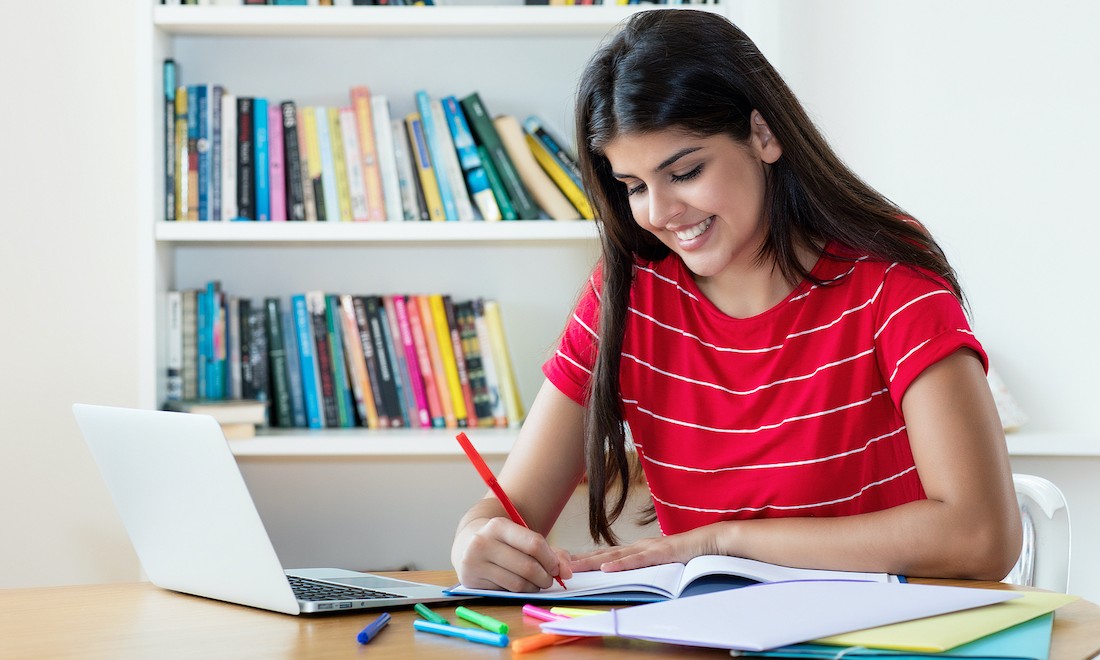 Young woman learning a language online