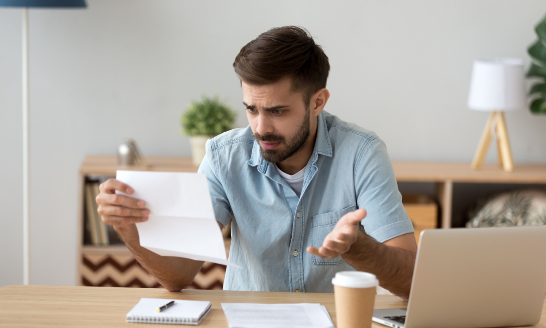 gmw lawyers confused man looking at paper