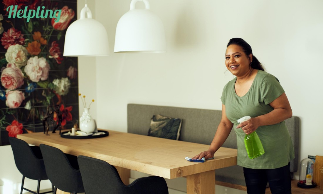 woman cleaning table helpling