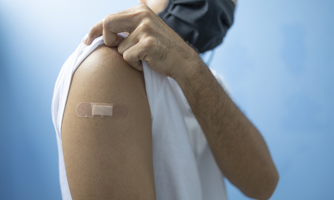 Coronavirus vaccination the Netherlands man arm plaster