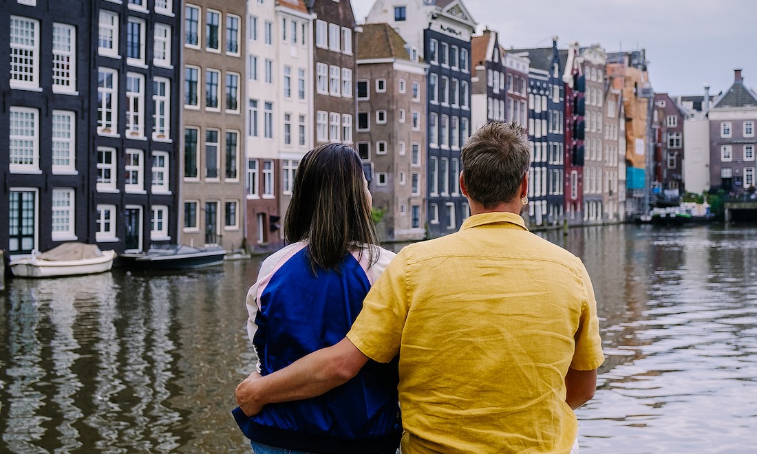 Expat couple in the Netherlands by canal