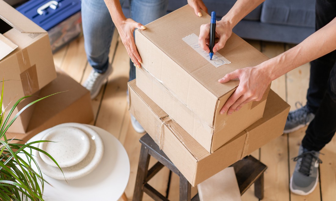 people packing boxes, moving