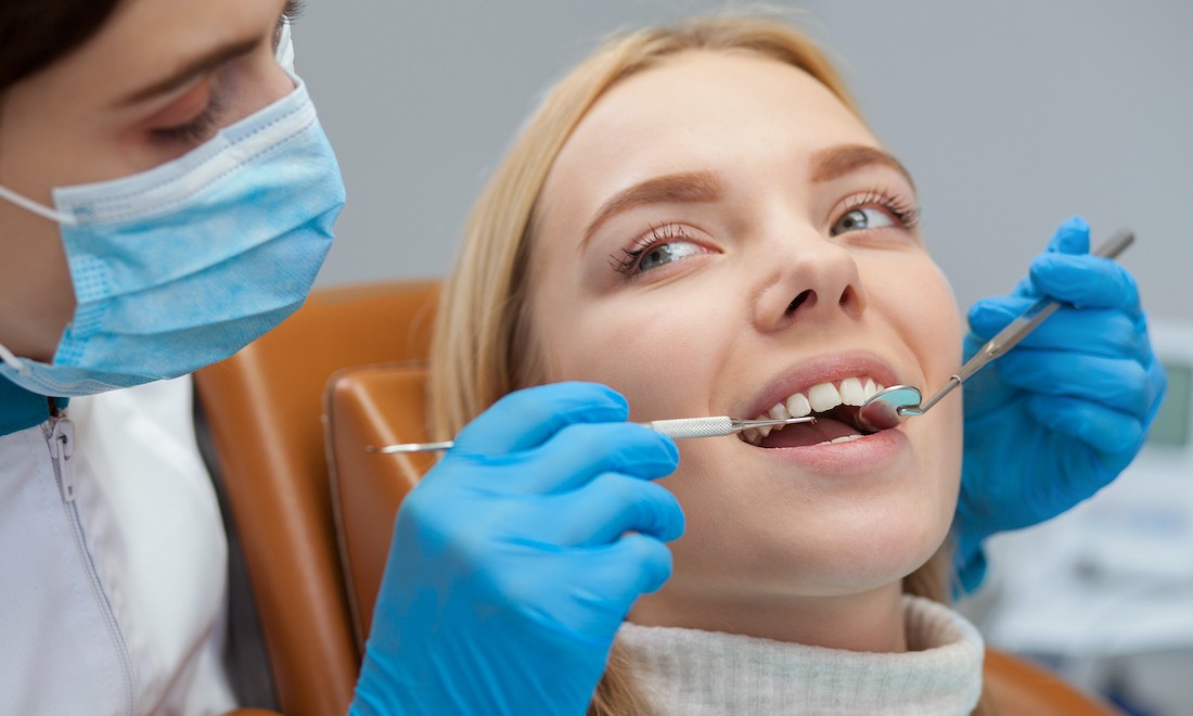 Woman getting a check-up at the dentist