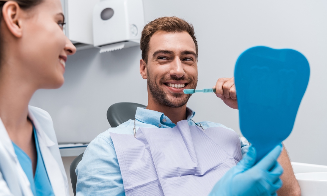 Happy man at dentist's office