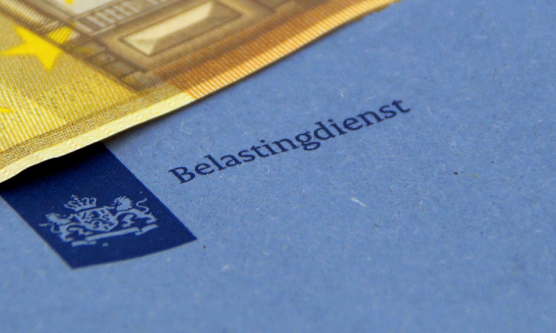 Dutch tax authority blue envelope with a bank note