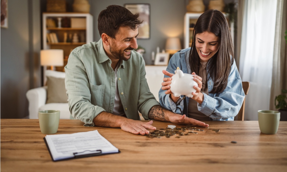 woman breaking open her piggy bank