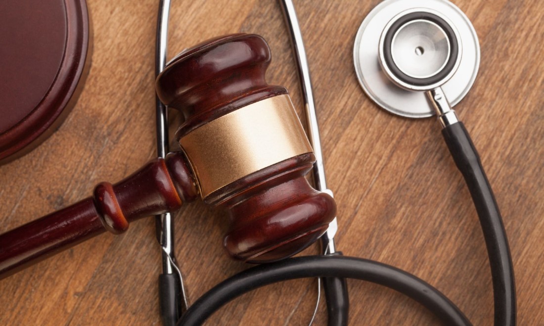 close up of gavel and stethoscope