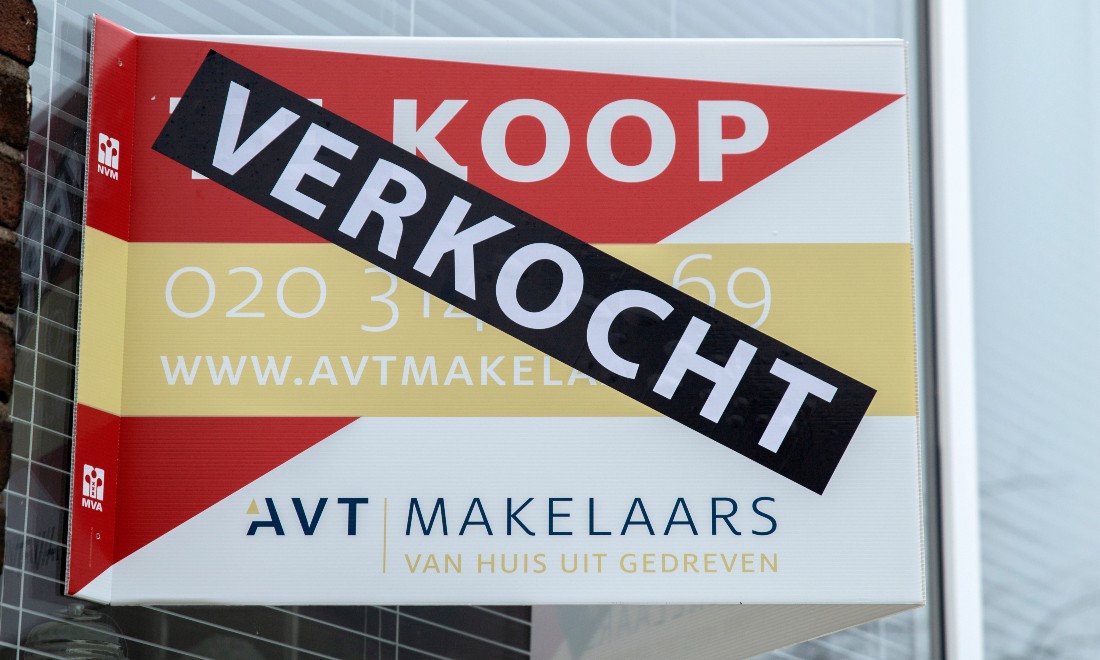 For sale sign on the window of a residential property in the Netherlands