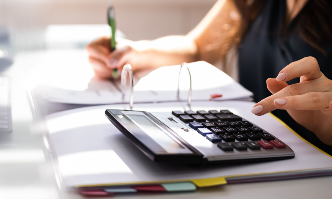 FAIR woman using calculator