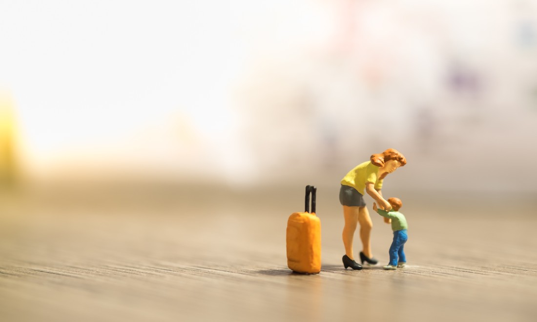 miniatures woman, child, suitcase