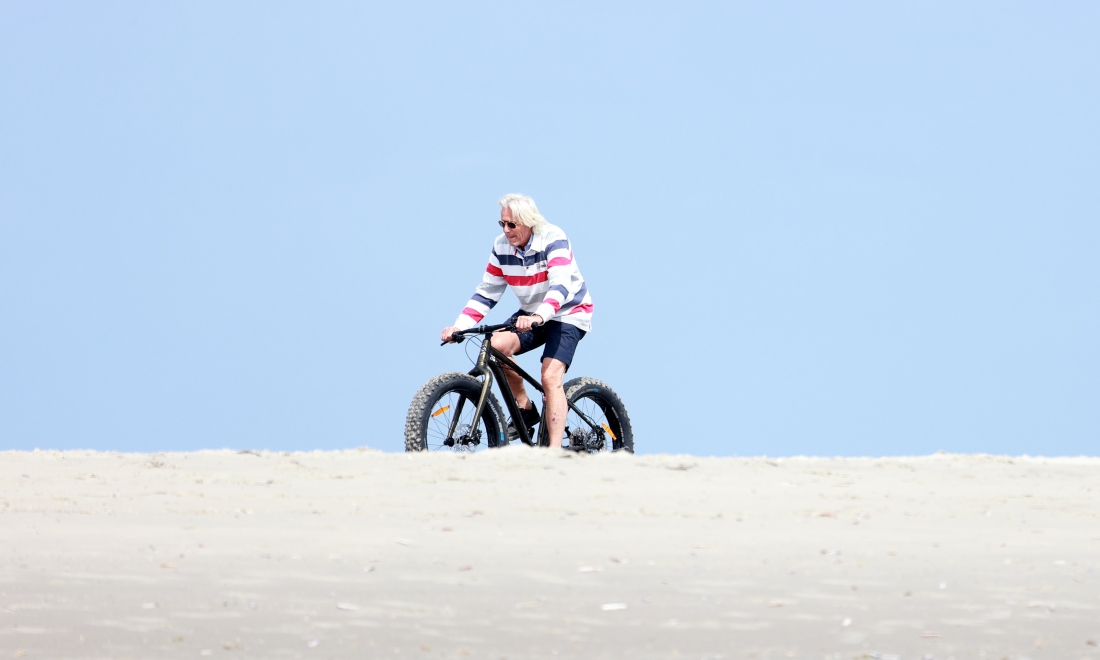 Man cycling on a fatbike in Schiermonnikoog, the Netherlands