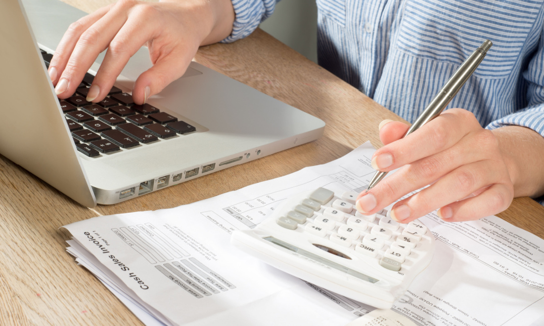 Man filing taxes with laptop 