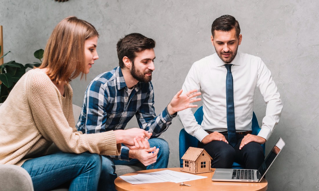 couple meeting with real estate agent