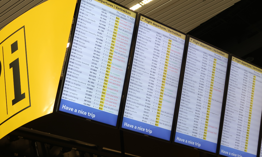 Info board departing flights Schiphol Airport