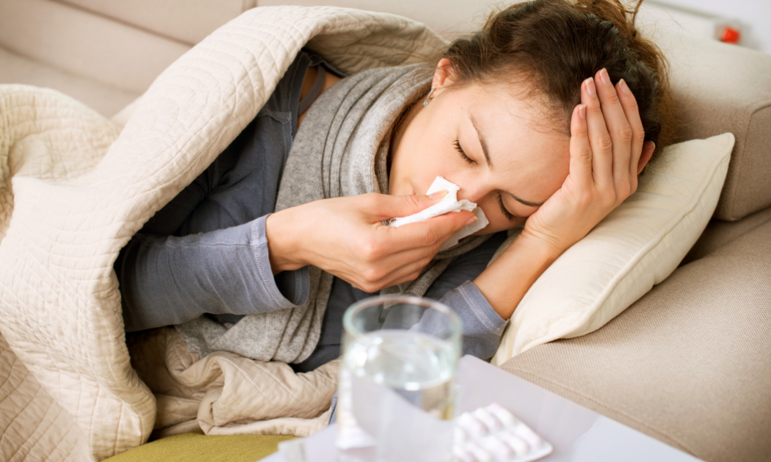 Woman sick at home with flu