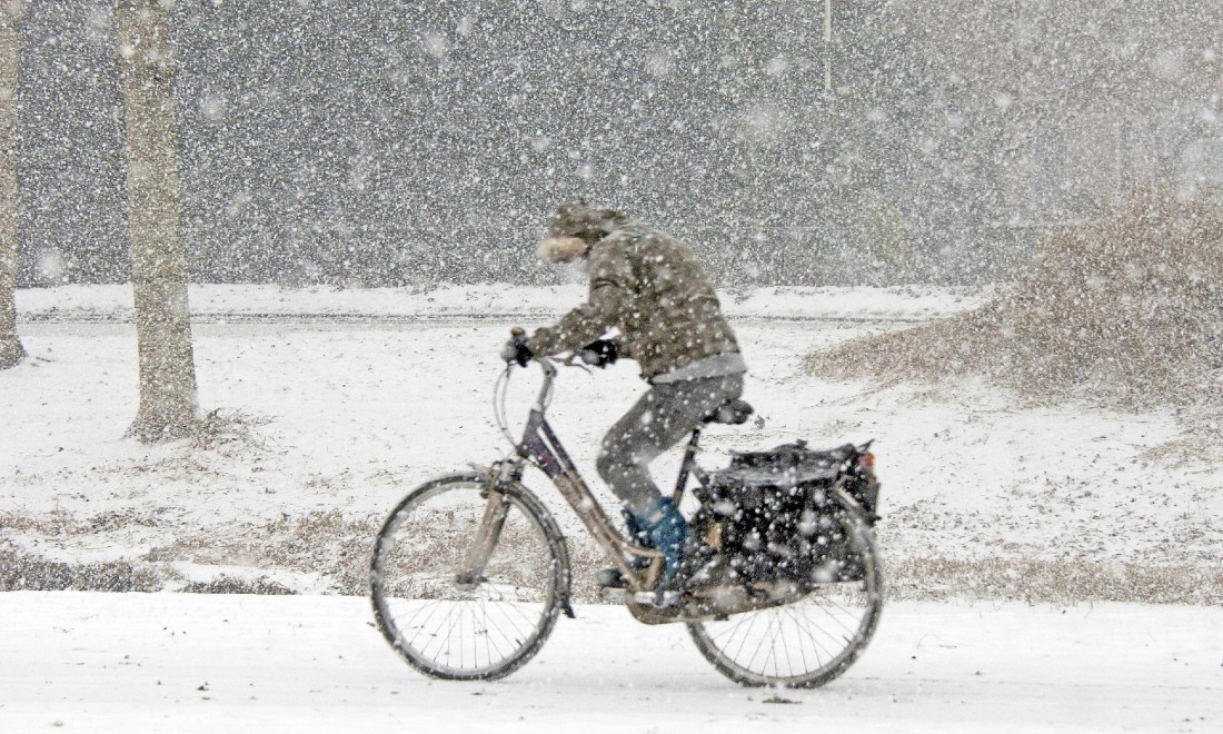 gmw lawyers - cyclist biking in snow storm - personal injury law