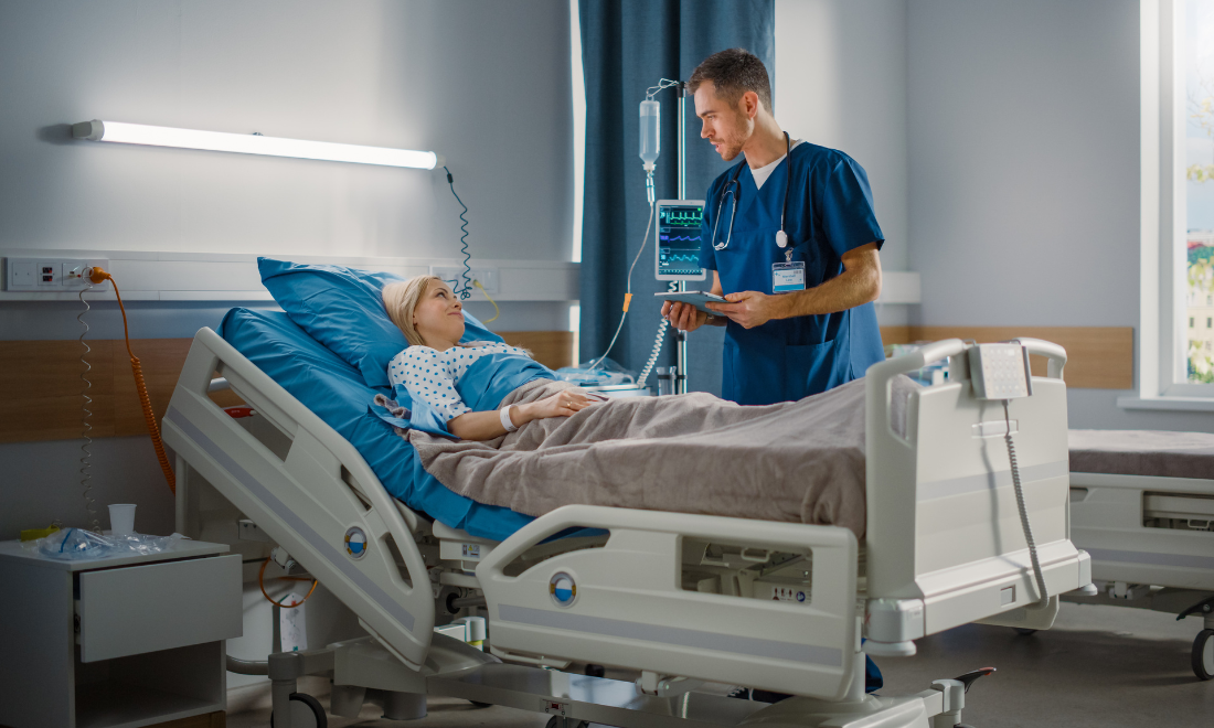 Hospital worker talking to patient