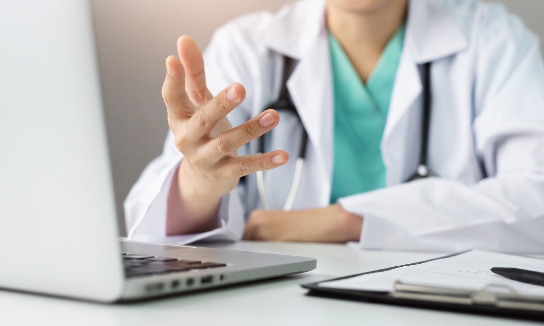 doctor talking to patient online via laptop