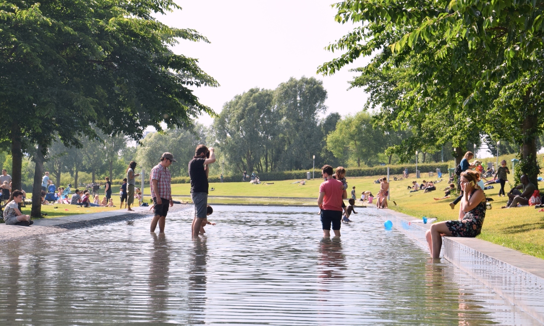 People enjoying the hot summer weather in Westerpark in Amsterdam