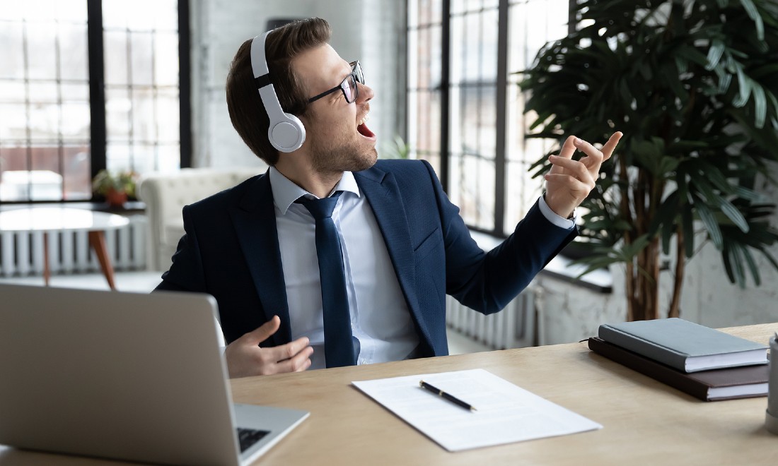 man singing at office - how to become a rockstar in your field