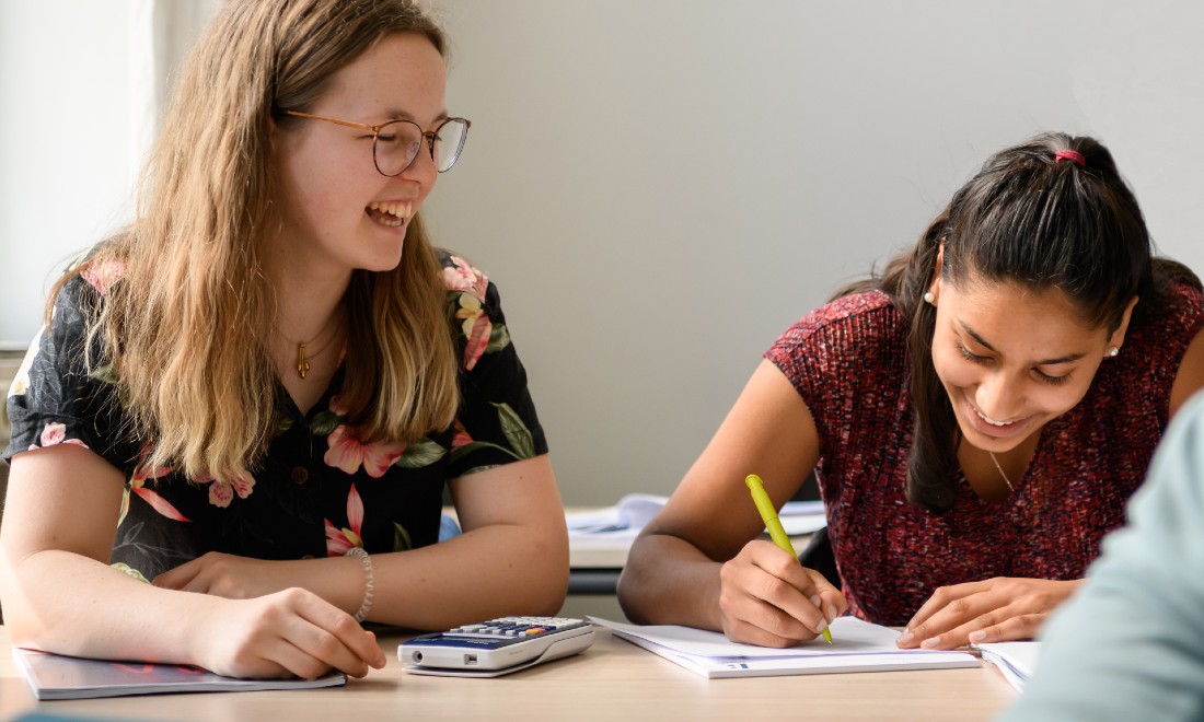 IB.Academy IB students doing course work