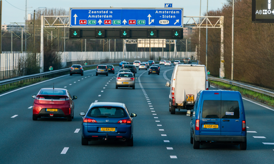 Cars driving on Dutch road to Amsterdam