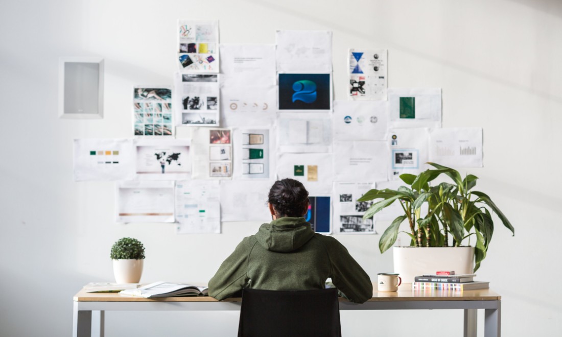 Person behind desk working laptop