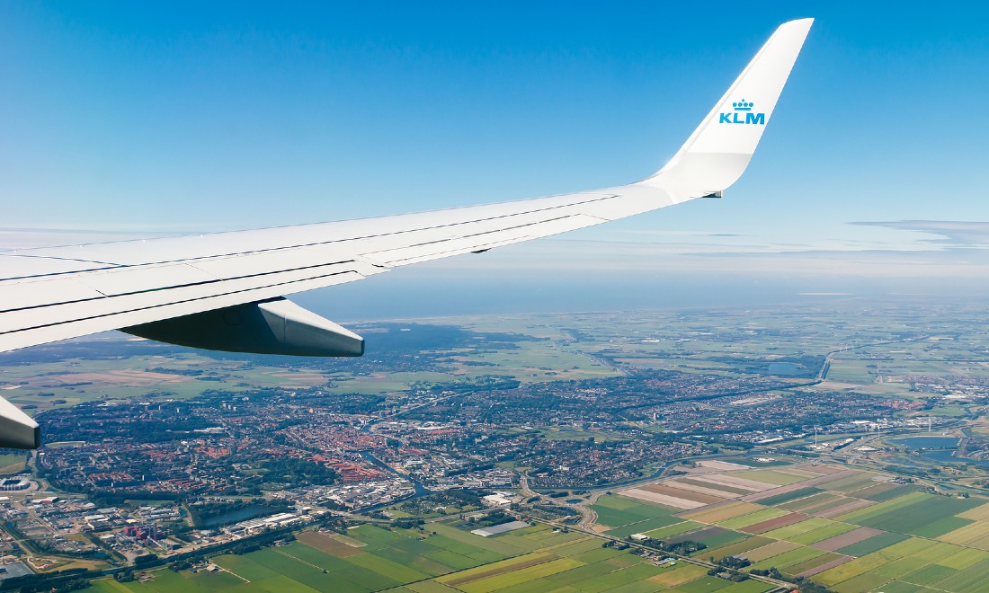 KLM plane flying Schiphol Airport Amsterdam the Netherlands