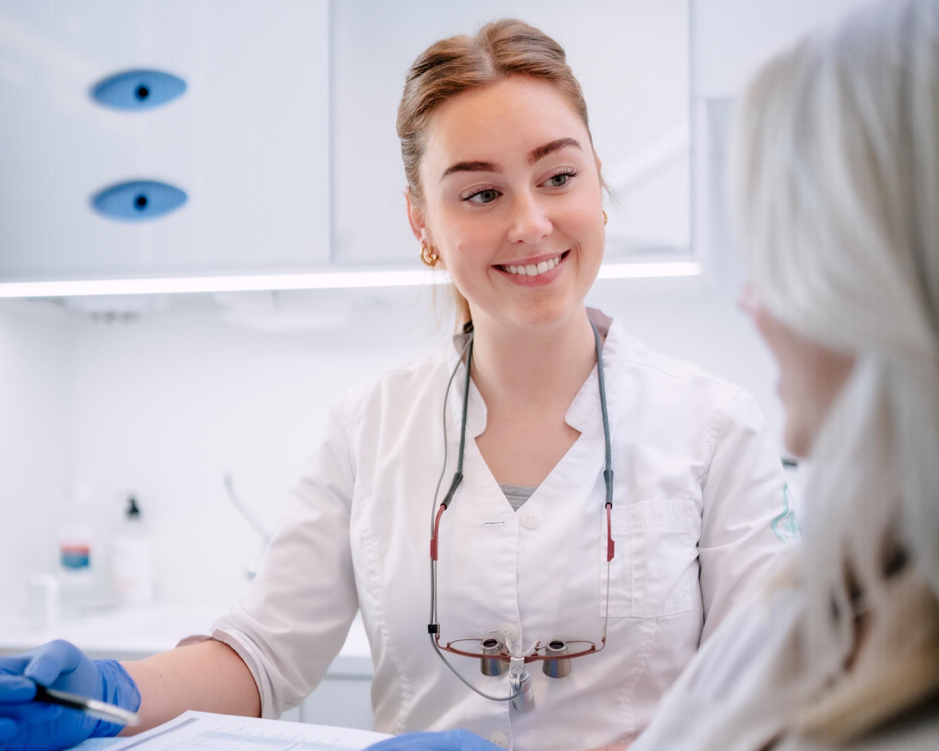 female dentist smiling at patient