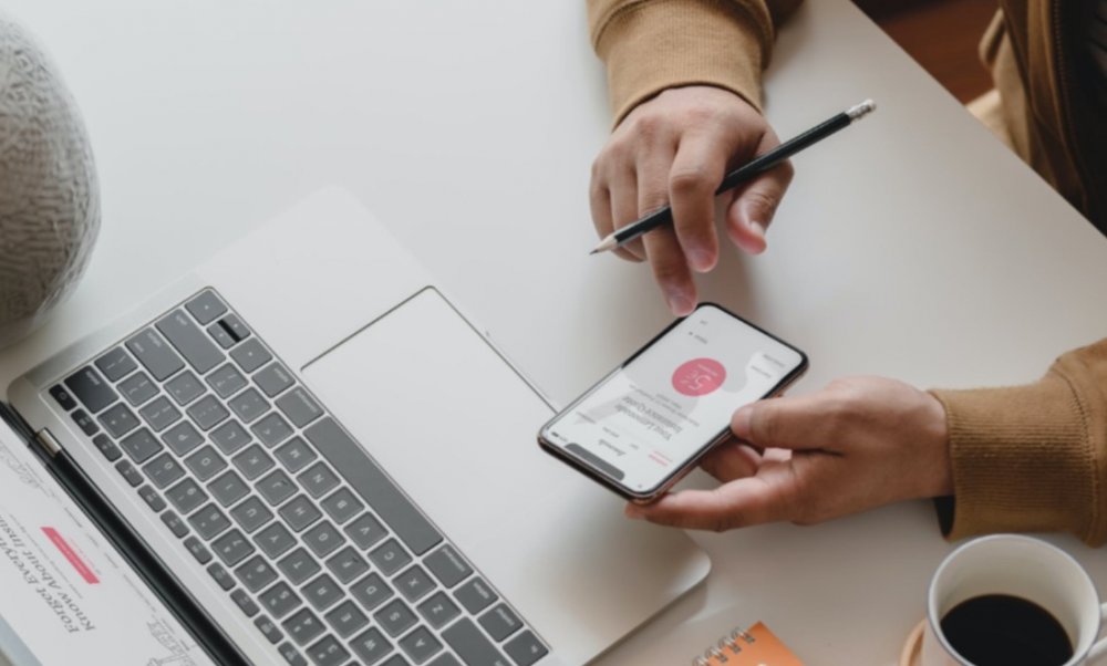 person using lemonade app smartphone