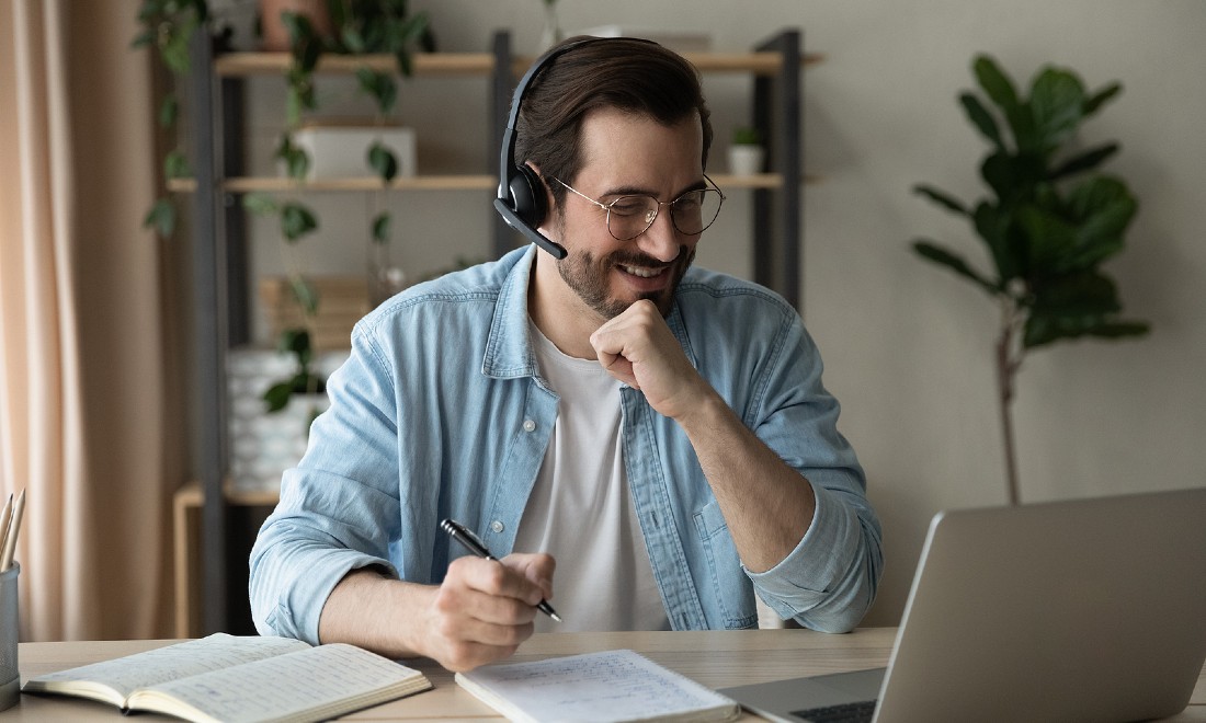 man taking online lessons at home