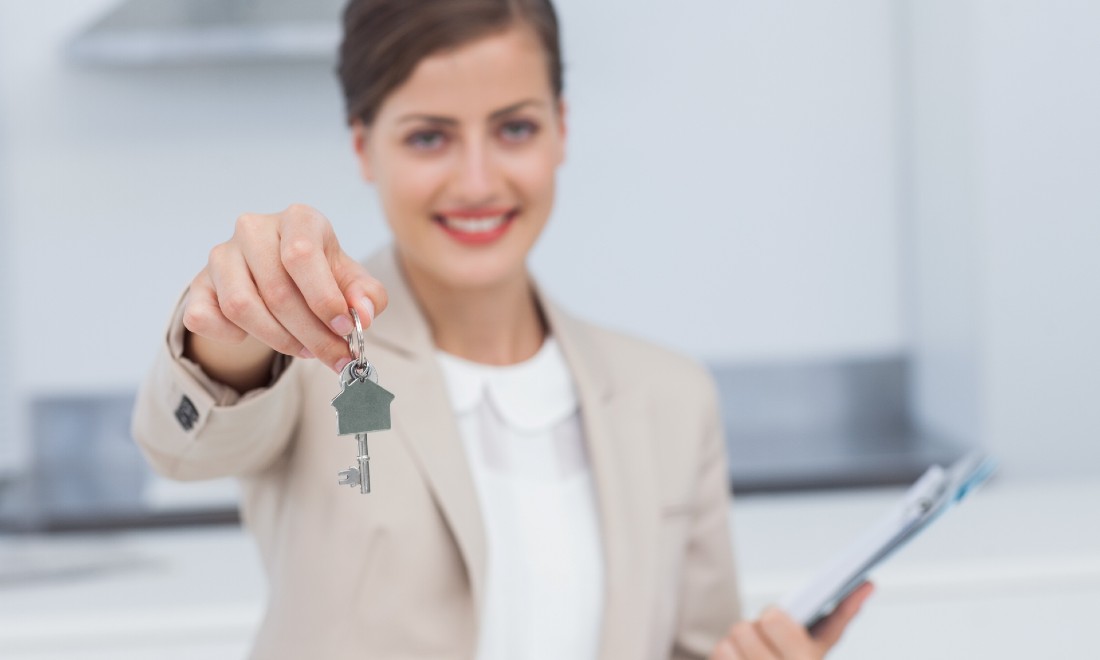 Realtor giving keys of house