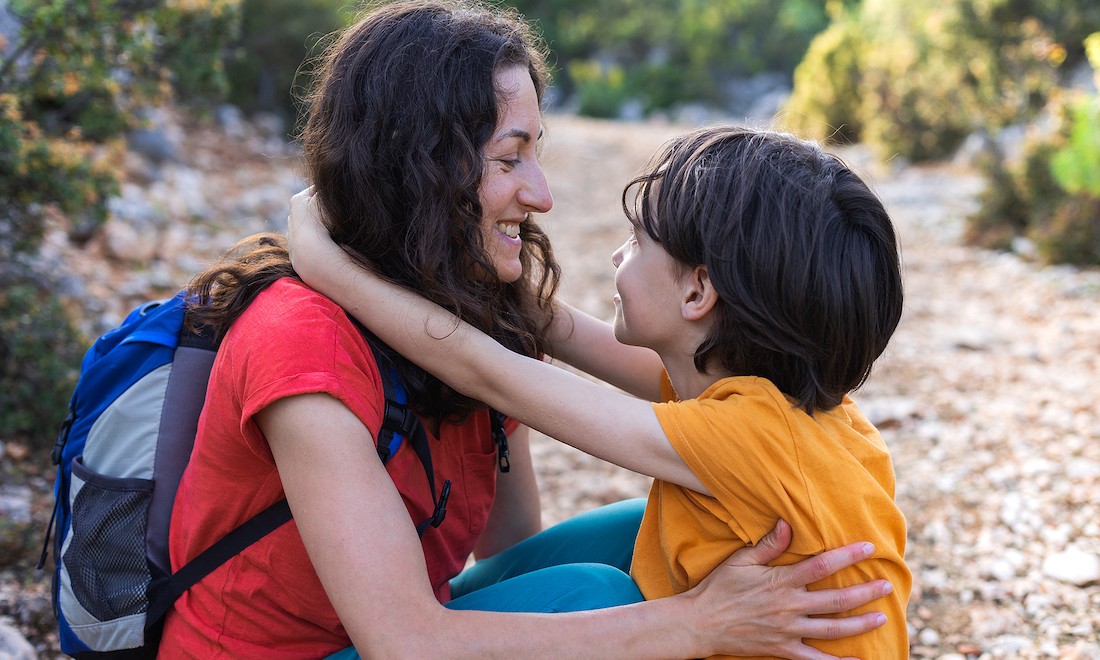 Mother comforts son