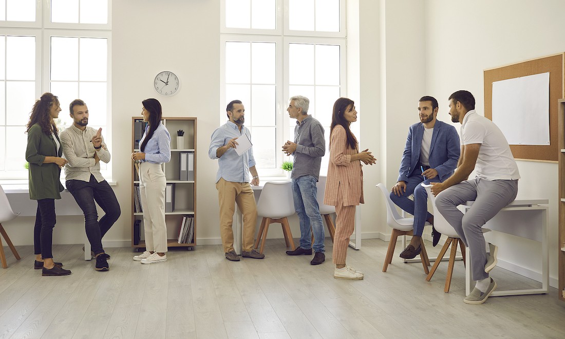 People having conversations in an office