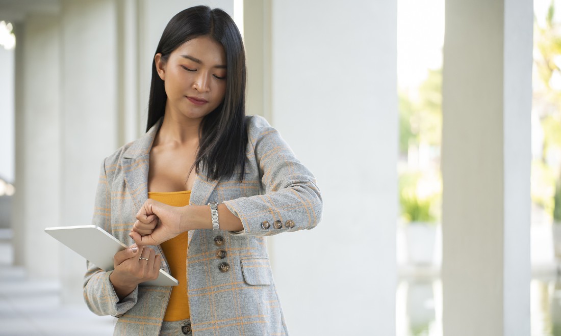 woman looking at watch