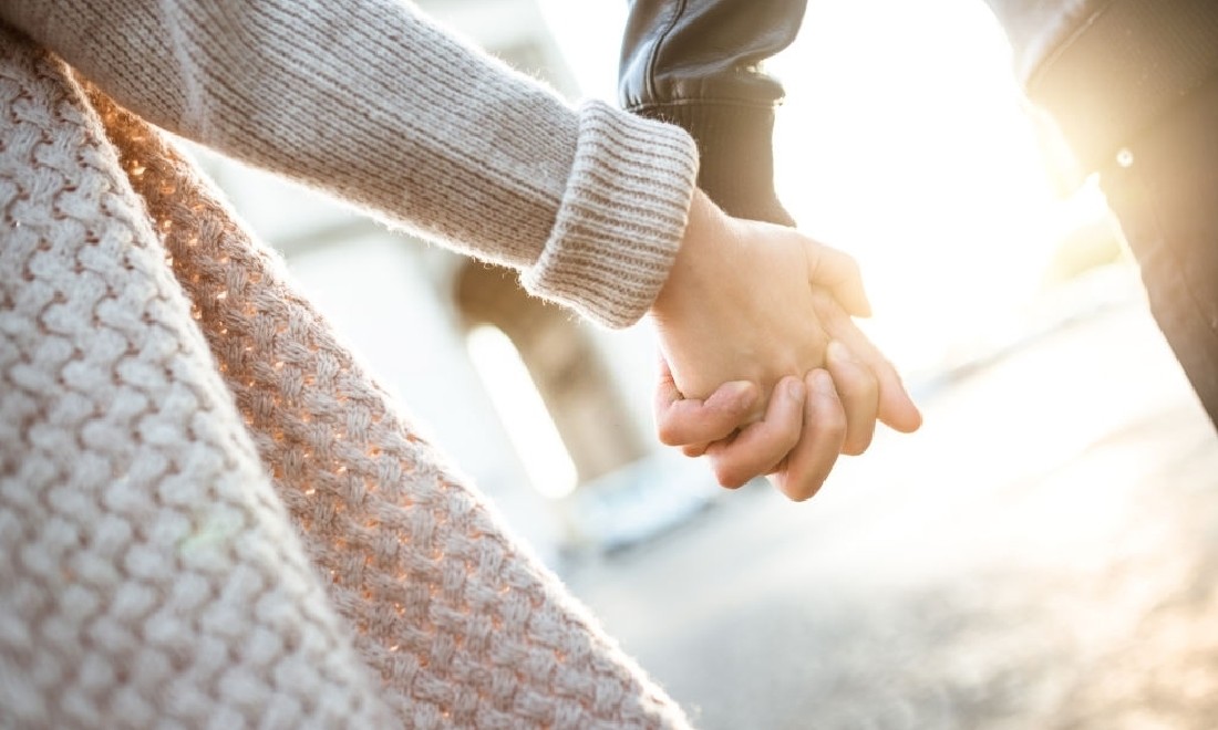 People holding hands for support