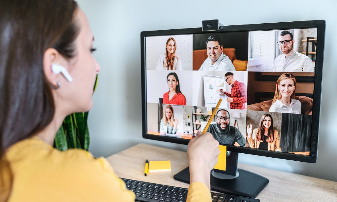 woman in zoom meeting with colleagues